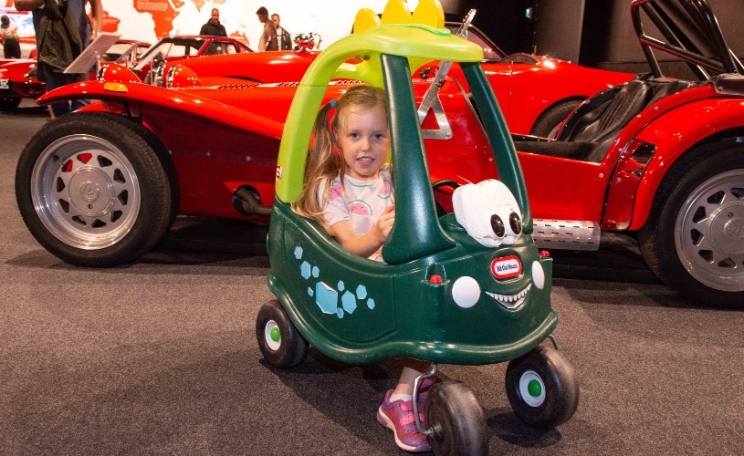 Little girl in Little Tikes car at Haynes Motor Musuem